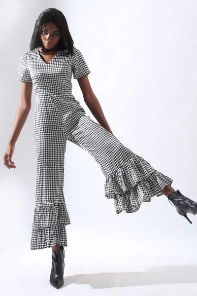 Image of woman in custom made jumpsuit with summer pattern