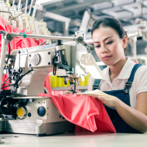 fashion worker sewing clothing