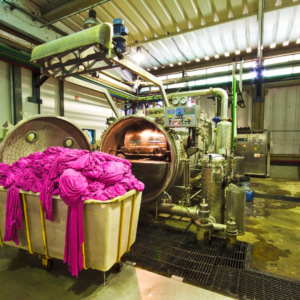 Fashion production supply chain photo of pink fabric being made
